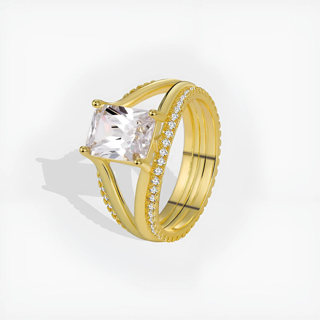 Gold-coloured geometric women's ring with a square zircon stone, shown in sizes 6 to 9.