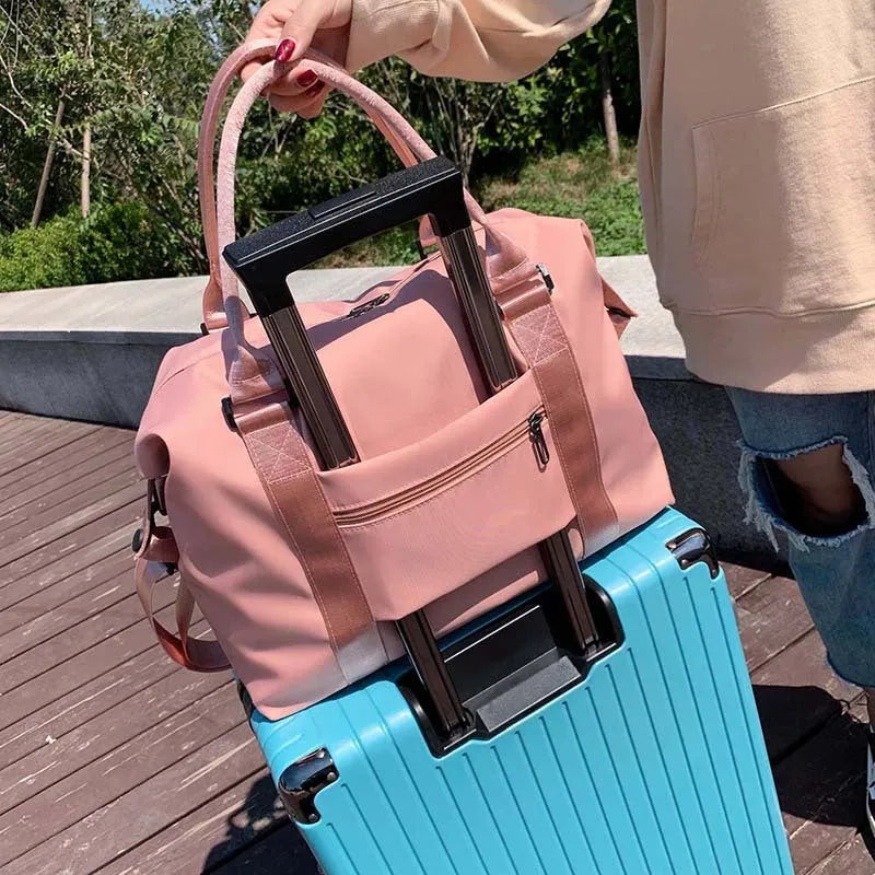 Medium 36-55L Oxford cloth travel duffel bag with zip pockets, soft handle, available in blue, black, grey and pink.