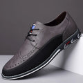 Men's black leather toe cap casual slip-on shoes with a rubber sole on a white background.
