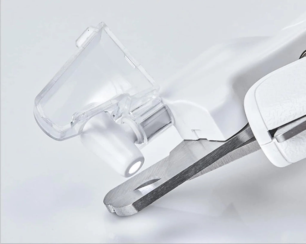 White LED pet nail clipper with transparent splash guard and triangular blade for cats and dogs