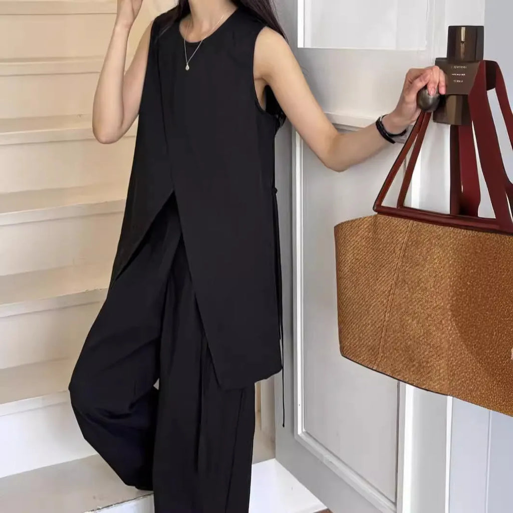 Split sleeveless lace-up top and high waist wide leg pants two-piece set in light apricot or black, average size