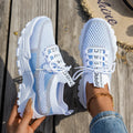 Women's Flyknit mesh lace-up sneakers in low flat heel design for walking and running
