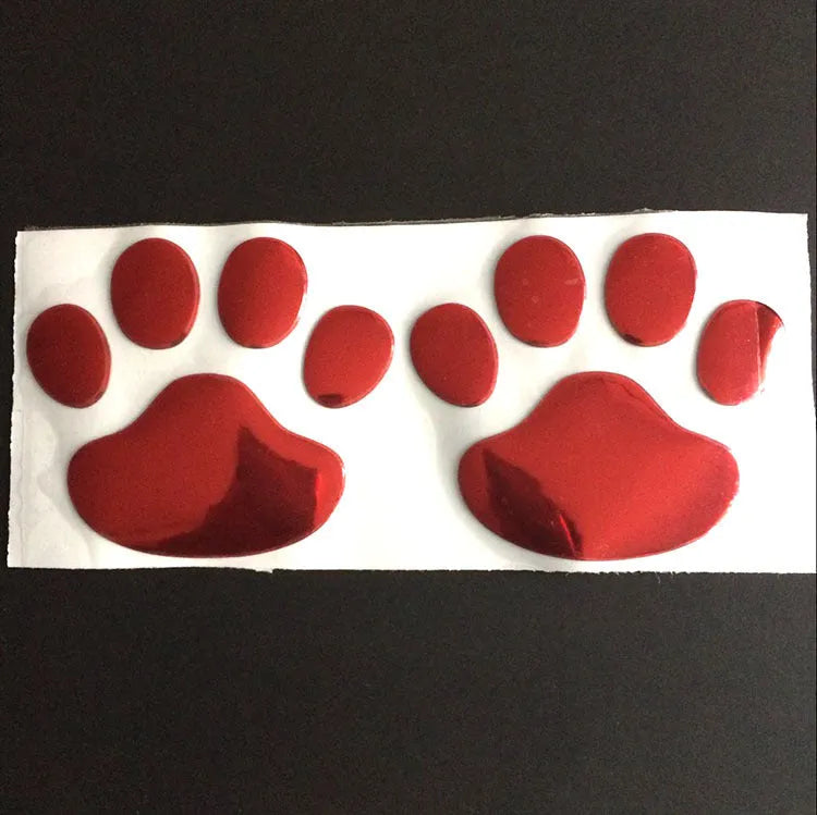 PVC hand-shaped car sticker with dog footprints in red, silver, gold, and black colour options.