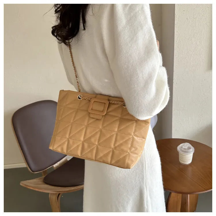 Women's soft PU shoulder bag with chain strap in trapezoid shape, black colour option