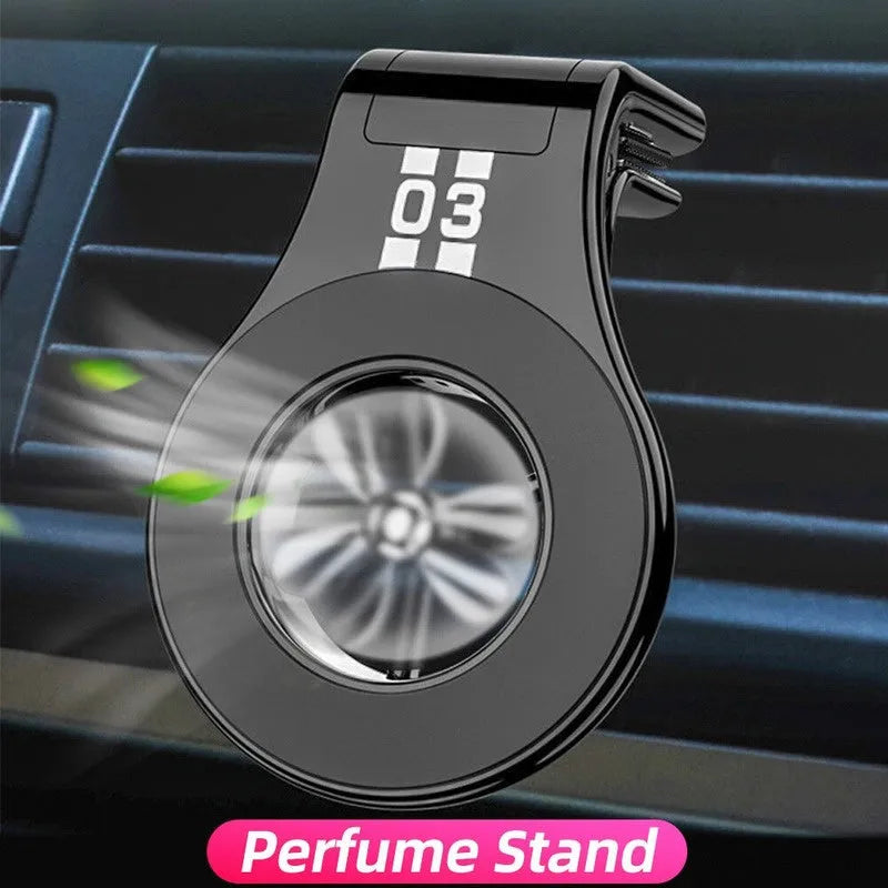 Magnetic car phone holder with fragrance diffuser clipped to car air vent
