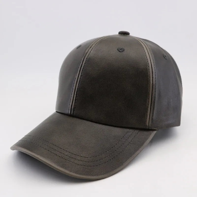 Washed and worn PU baseball cap with hard top peak, adjustable dome crown, brown colour, street travel fashion