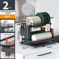 White double-layer kitchen storage rack with removable draining tray on countertop