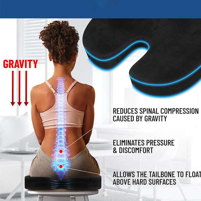 Black U-shaped memory foam seat cushion for office chair tailbone support.