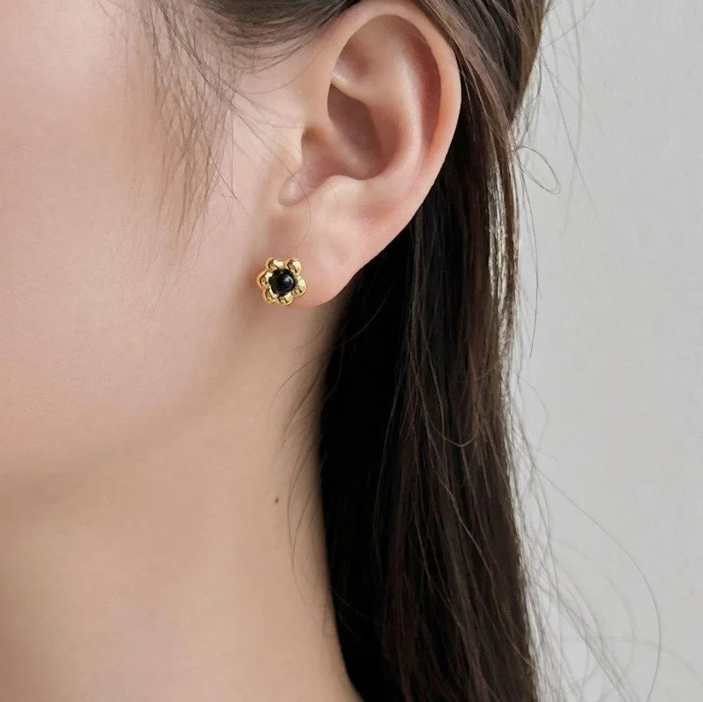 Pair of S925 sterling silver ear studs with black agate flower centre, gold colour, simple geometric shape