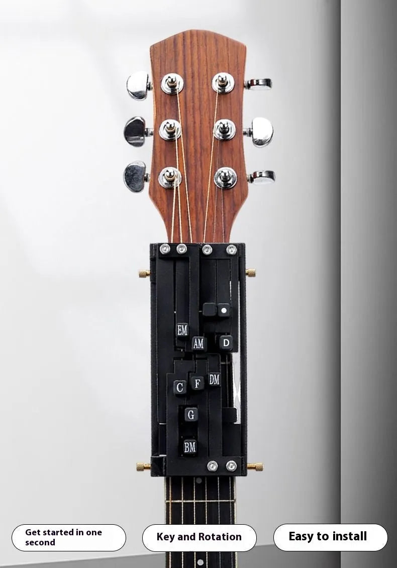 Black automatic guitar chord changing device for folk music beginners on a guitar neck.