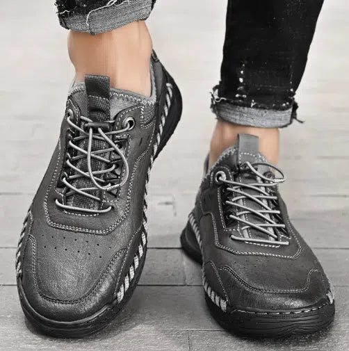 Men's hand-stitched round toe sneakers in black synthetic PU, low heel 1-3 cm, lace-up closure, side view