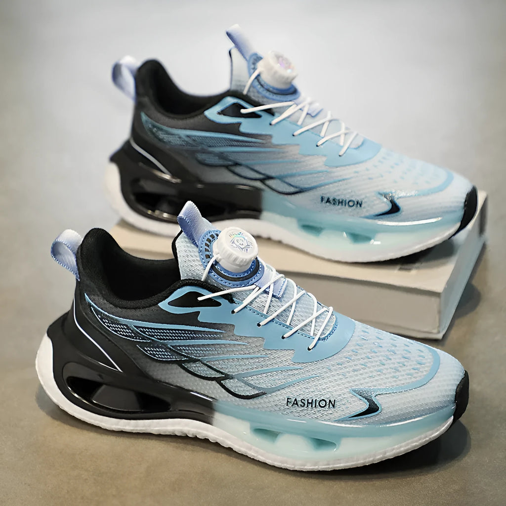 Youth low-top casual sneaker with rotating button detail on sole, shown in light blue mesh.