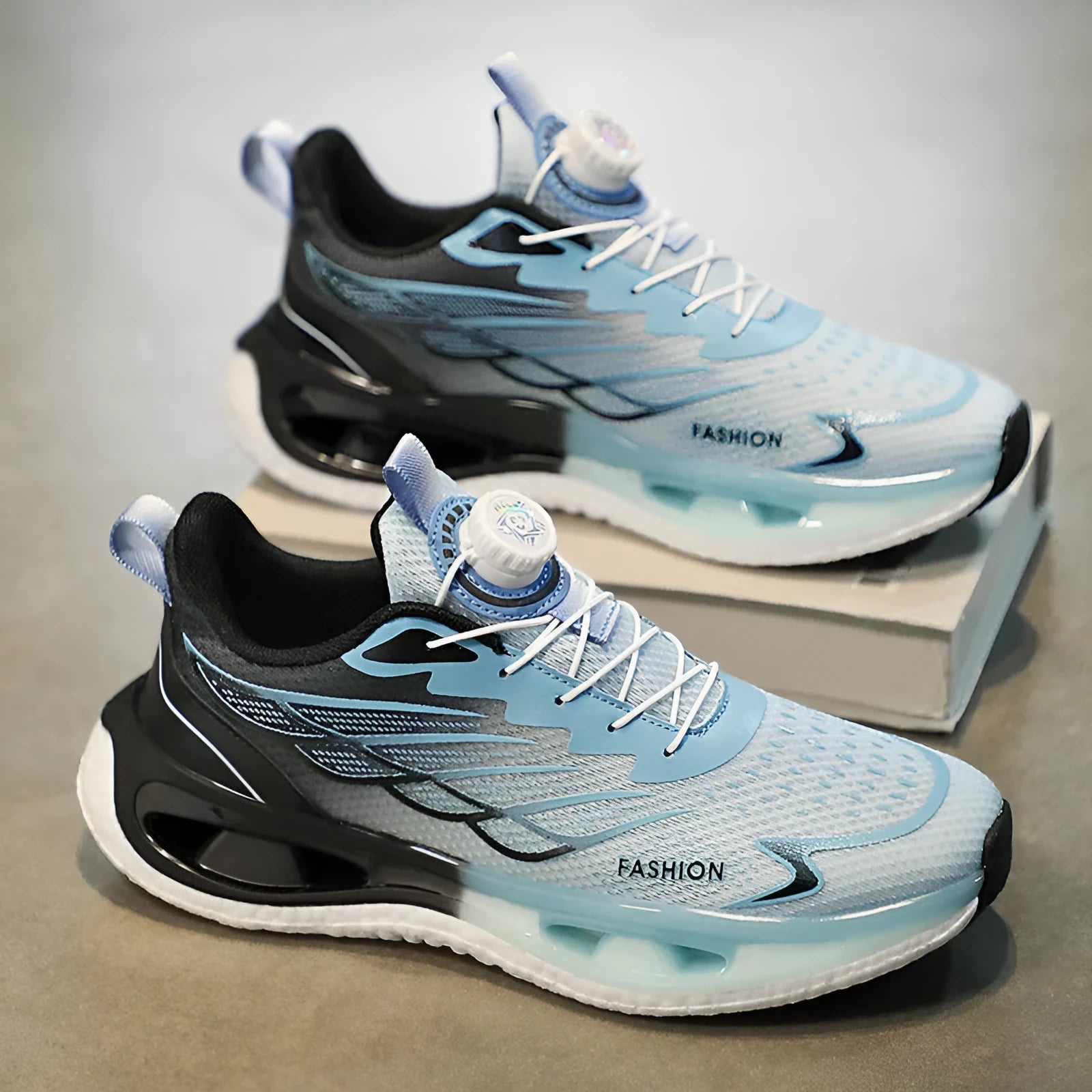 Youth low-top casual sneaker with rotating button detail on sole, shown in light blue mesh.