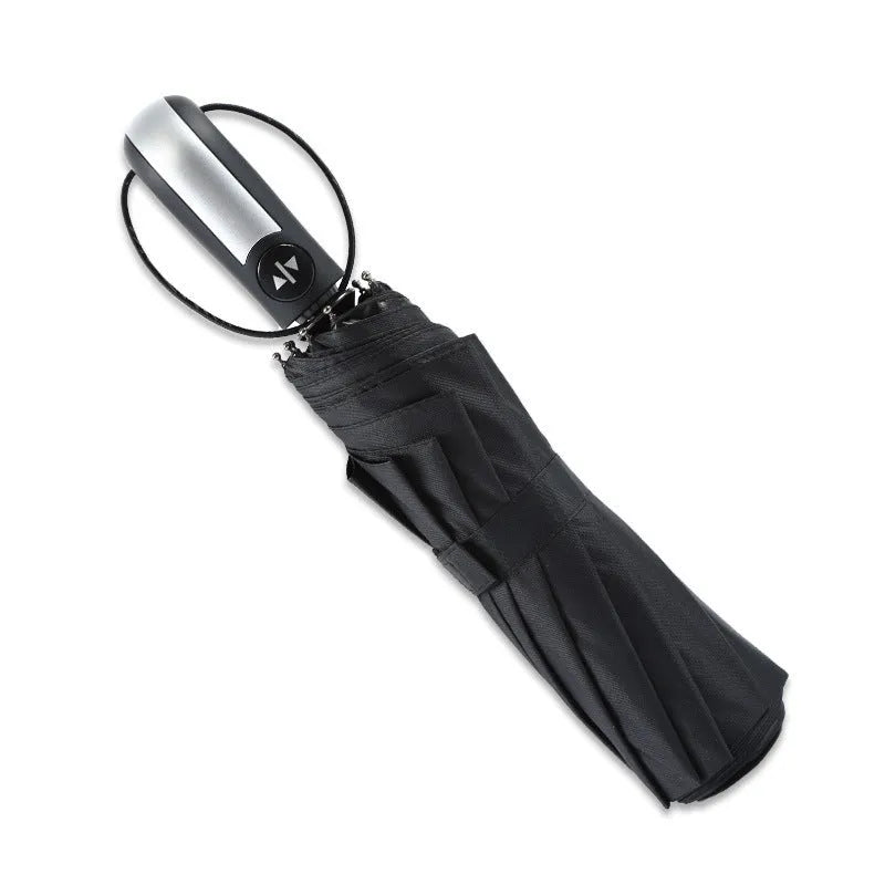 Black triple folding business umbrella with automatic opening mechanism and rubber handle