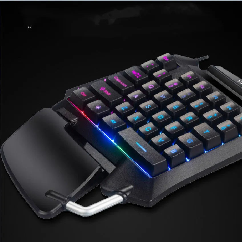 Black left-hand gaming keyboard with throne converter design showing multimedia keys and integrated wrist rest