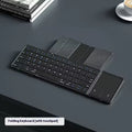 Black folding Bluetooth keyboard for mobile phones and tablets showing compact folded design