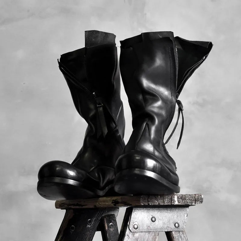 Black Japanese irregular deconstructed leather boots for men with high cylinder, round toe, thick bottom, and zipper closing.