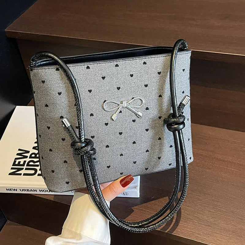 Canvas polka dot crossbody bag in bow design with double shoulder straps, hard medium shape, four colour options