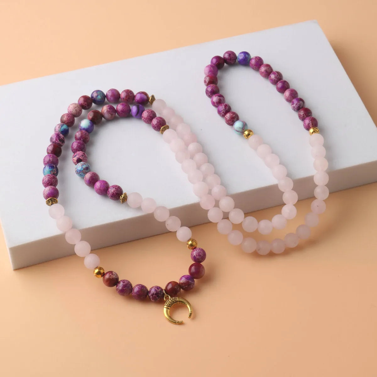 Pink crystal beads and Emperor Stone round pendant on women's personalised necklace