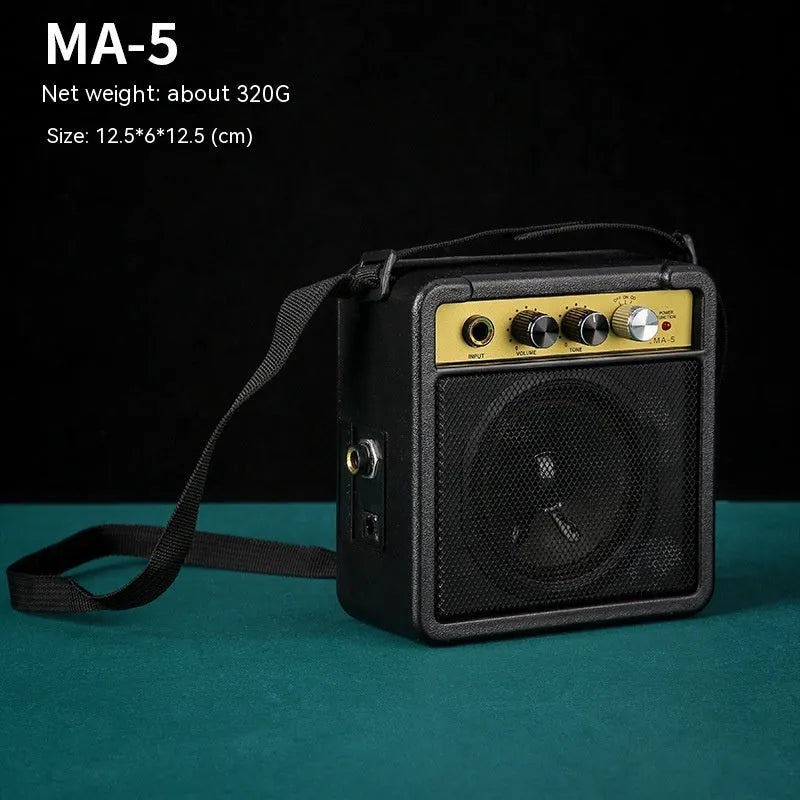 Small GA-10 10W guitar amplifier speaker with metal and plastic construction, 25x8x26cm