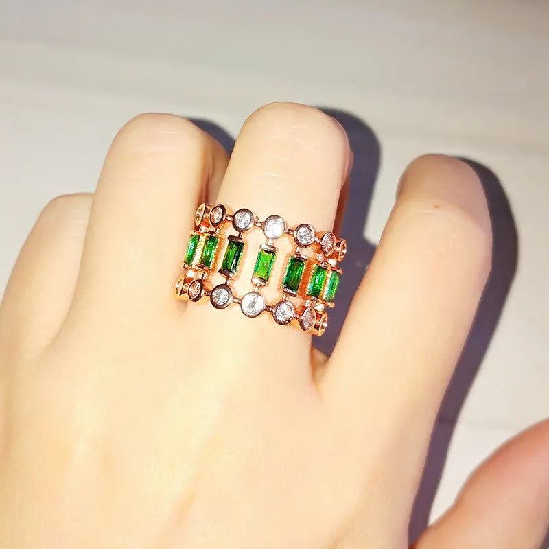 Gold-plated copper ring with hollow geometric setting and inlaid zircon stones