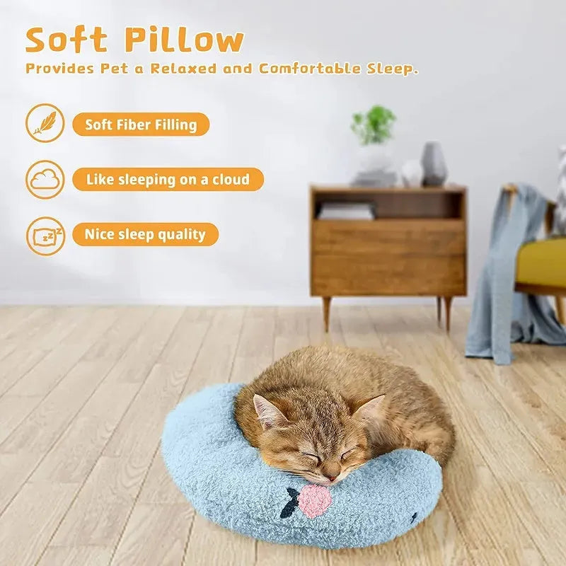 Blue U-shaped plush pet pillow for a small cat or dog on a grey background.