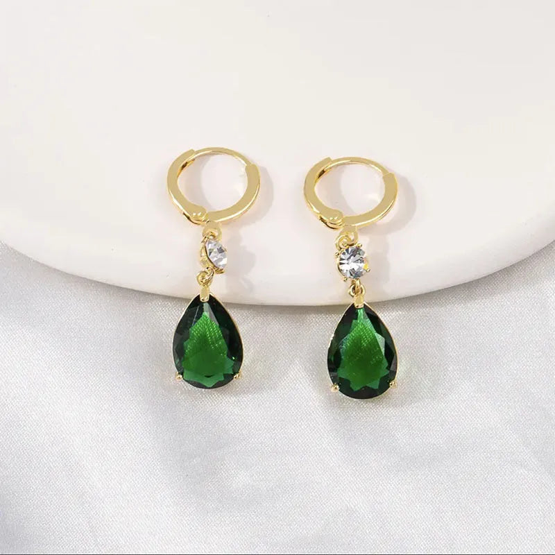 A pair of green geometric teardrop fashion earrings made from alloy.