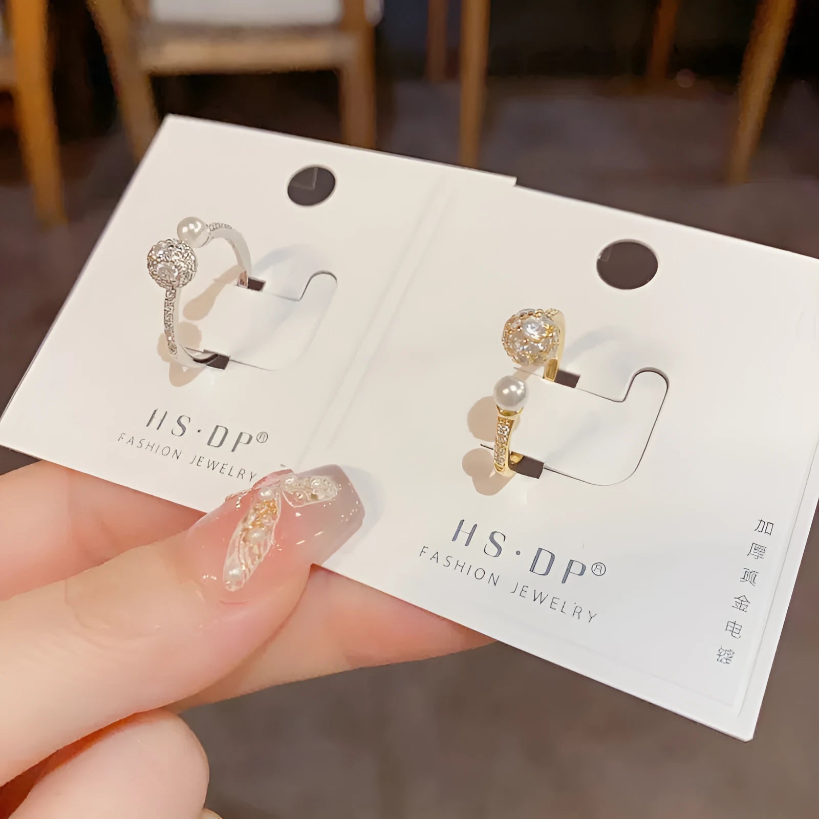 Open-end ring with round zircon stones in gold or silver plating