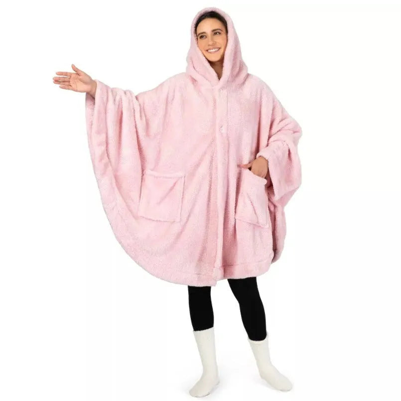 Thick pink hooded bathrobe with long sleeves and cardigan front on a hanger.