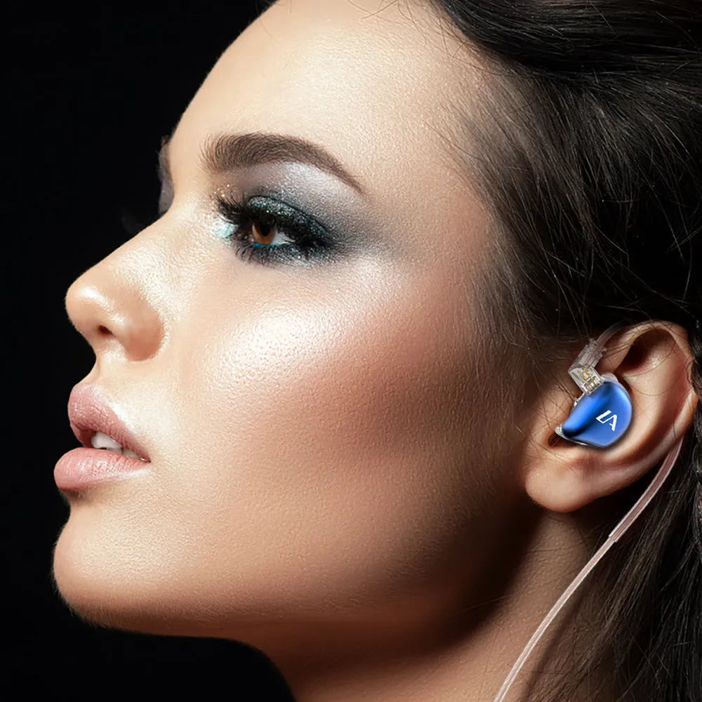 Ear hook wired in-ear headphones with 3.5mm plug, 1.2m silver-plated cable, and 10mm driver, shown in LE3 colour options