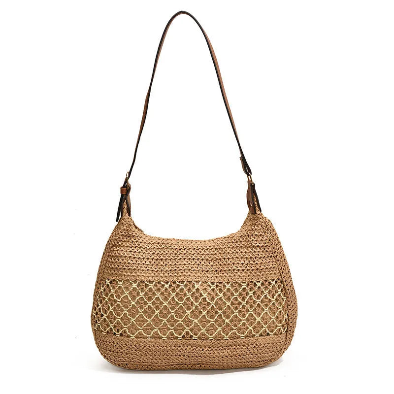 Women's khaki straw cross body bag with a square shape and outer pocket.
