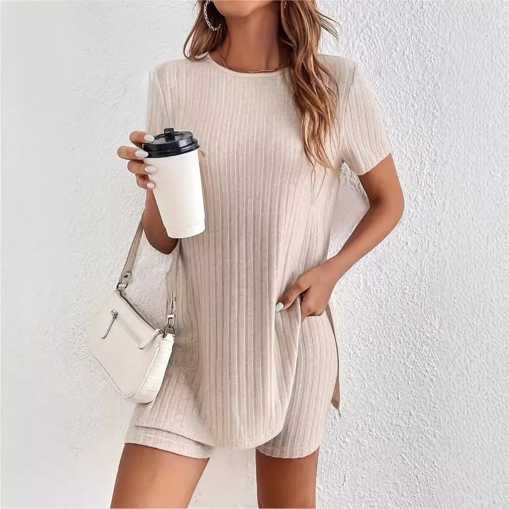 Women's casual cotton shorts suit in black, featuring a crew neck top with half sleeves and matching ribbed shorts.