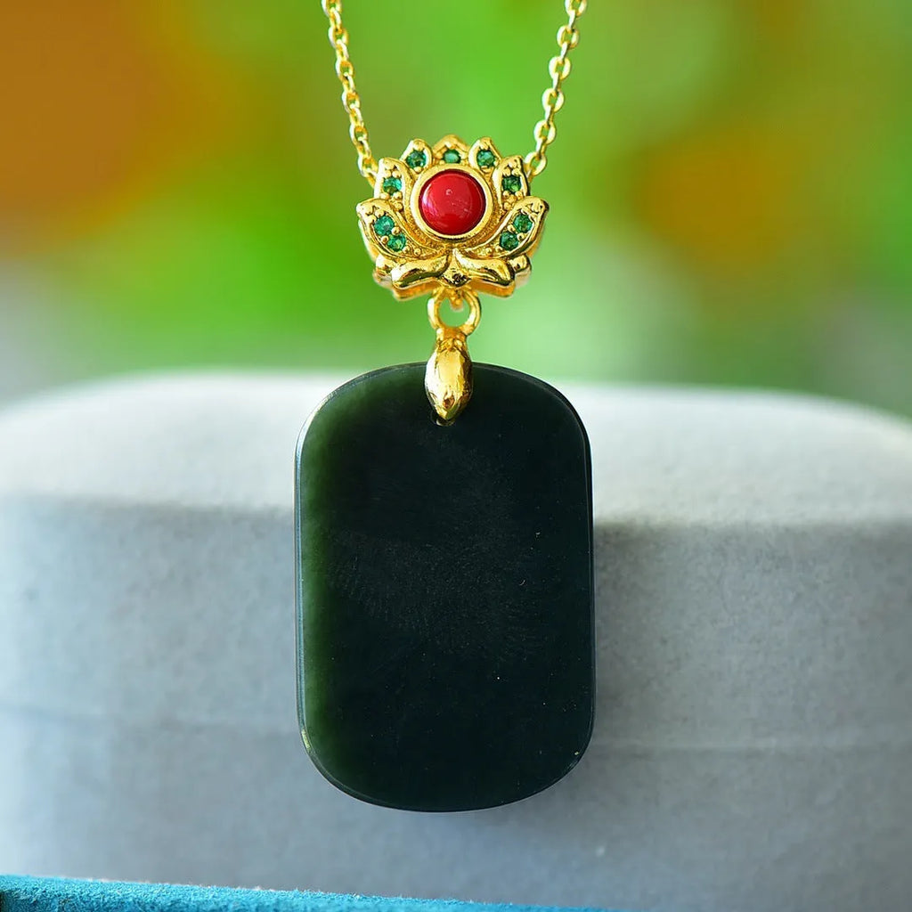 Flat natural Hetian grey jade pendant with copper inlay and ink blue jade accents on a necklace chain.