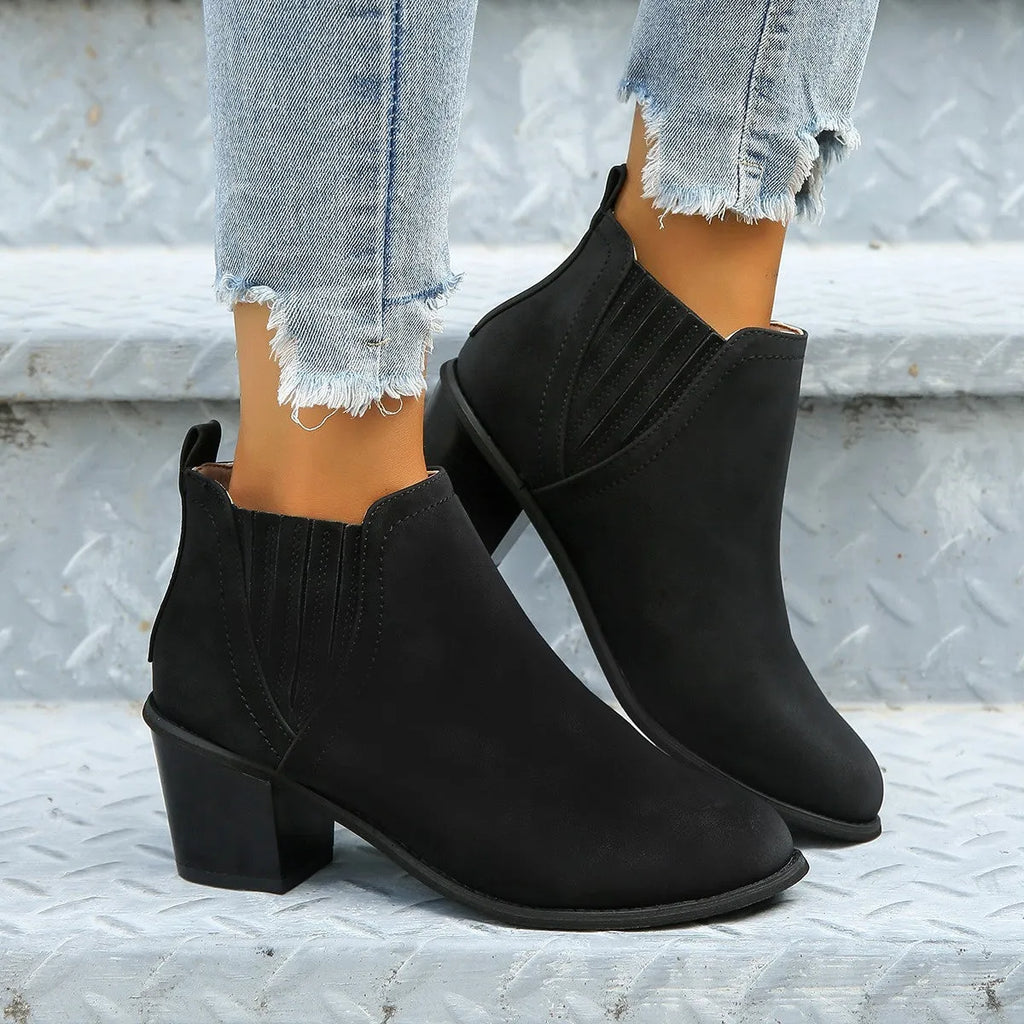 Women's black ankle boots with pointed toe and thick square heel slip-on design