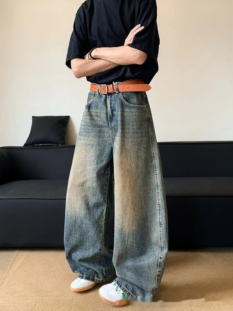 Men's retro blue distressed wide-leg jeans with micro-elastic cotton blend fabric showing distressed detailing