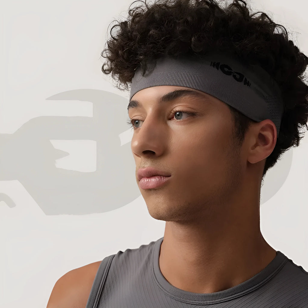 Seamless knitted exercise hair band in black colour showing stretch construction