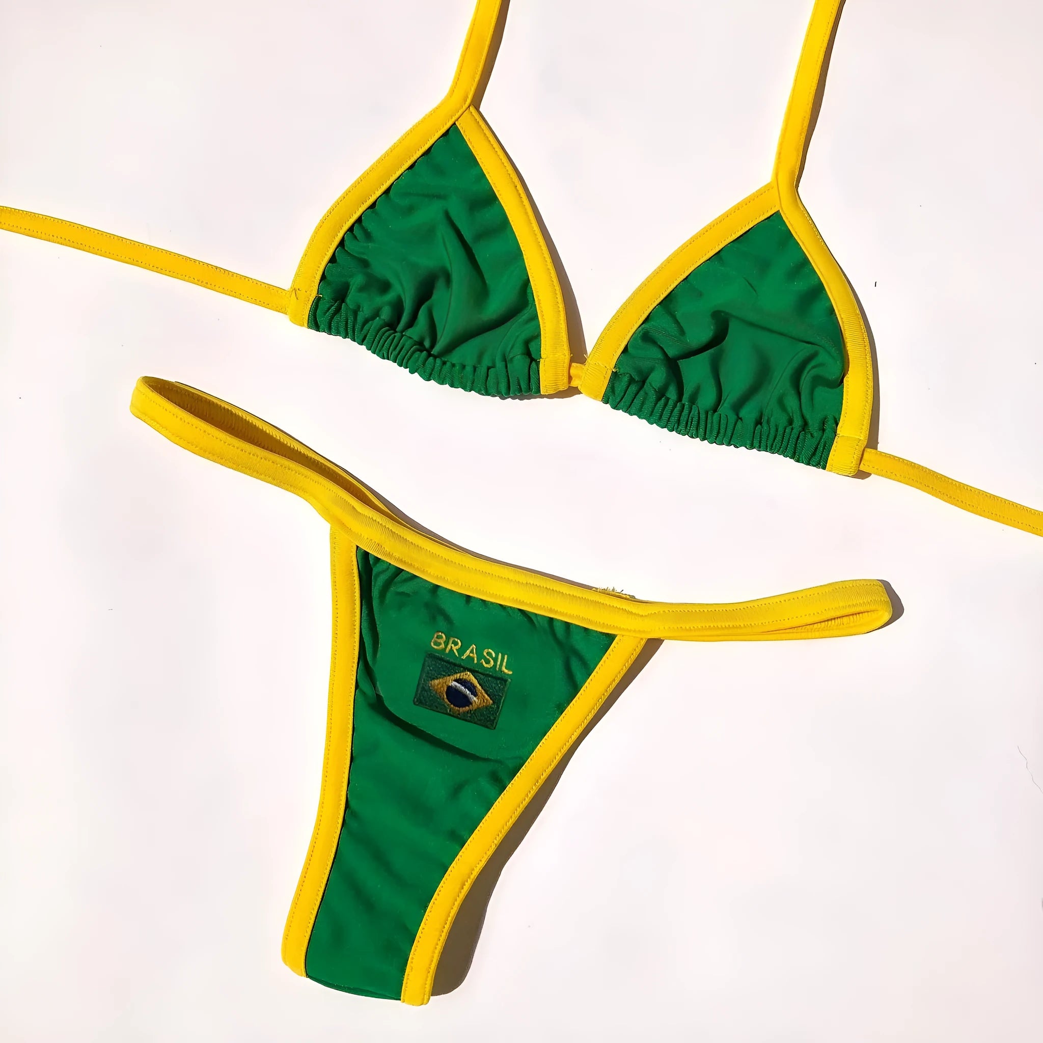 Yellow women's sleeveless T-back bikini bra and matching shorts set on a mannequin.