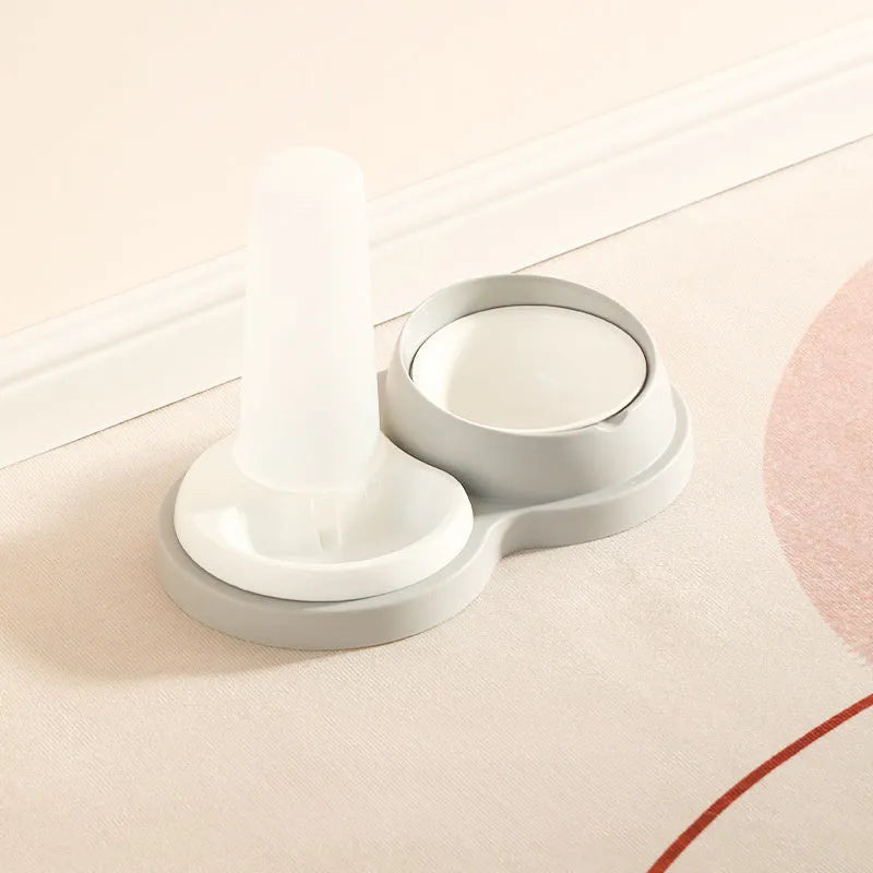 Grey ceramic dual pet feeding bowl with water dispenser and non-slip base.
