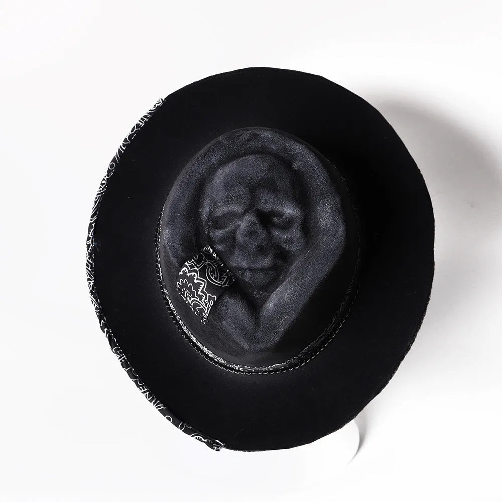 Handmade wool skull hat with a conical crown, shown in its specified colour, laid flat.