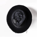 Handmade wool skull hat with a conical crown, shown in its specified colour, laid flat.