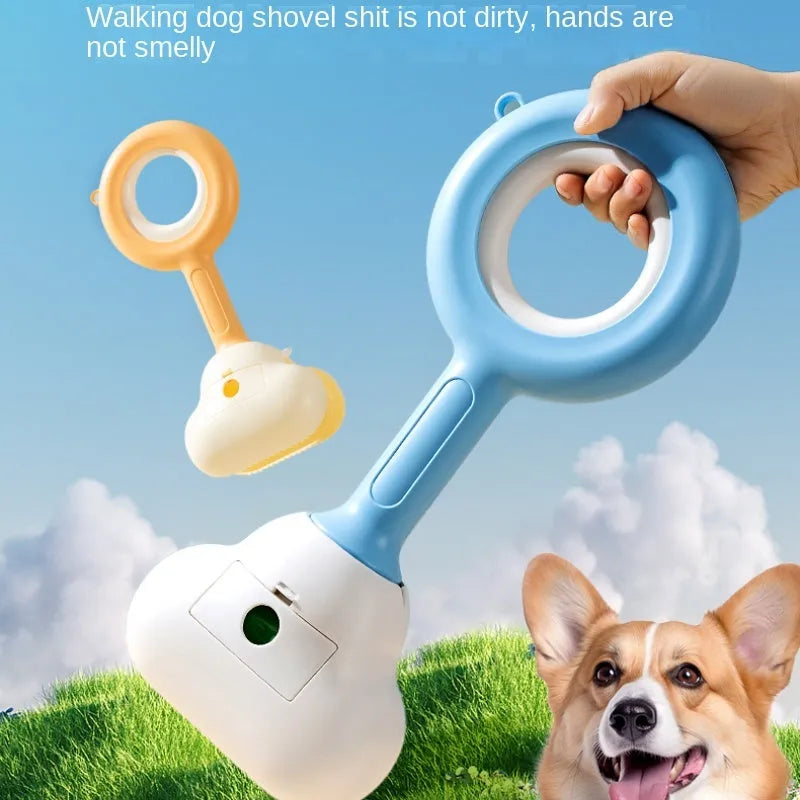 White blue dog pooper scooper with cloud-shaped jaw design on grass