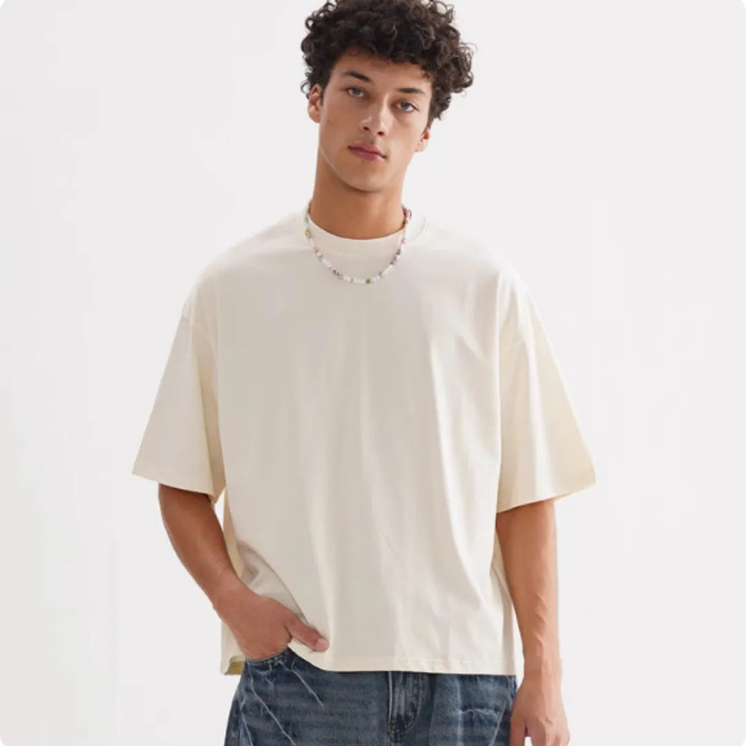 Men's loose fit pure cotton T-shirt in apricot colour showing front view