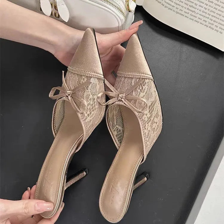 Women's light brown lace bowknot pointed toe high heels with mesh upper on a neutral background
