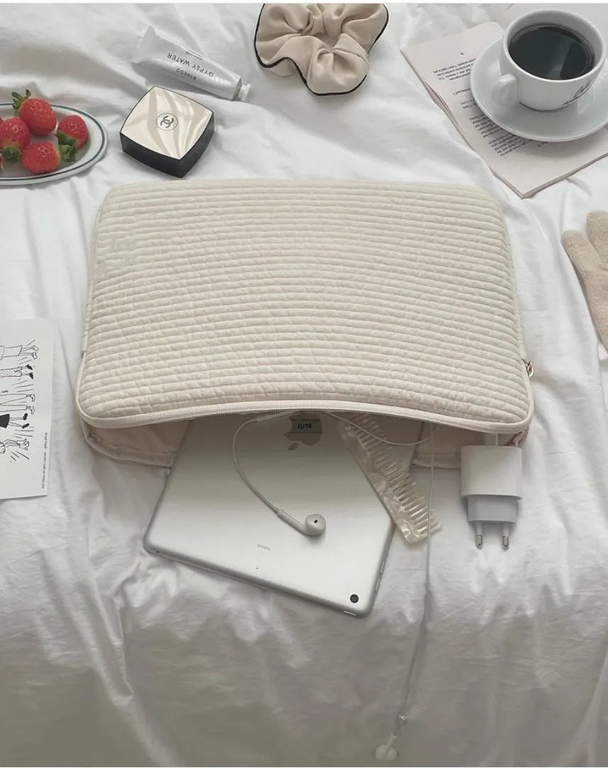 Black and white cotton cloth clutch-style laptop bag with internal coin pocket for anti-seismic tablet protection.