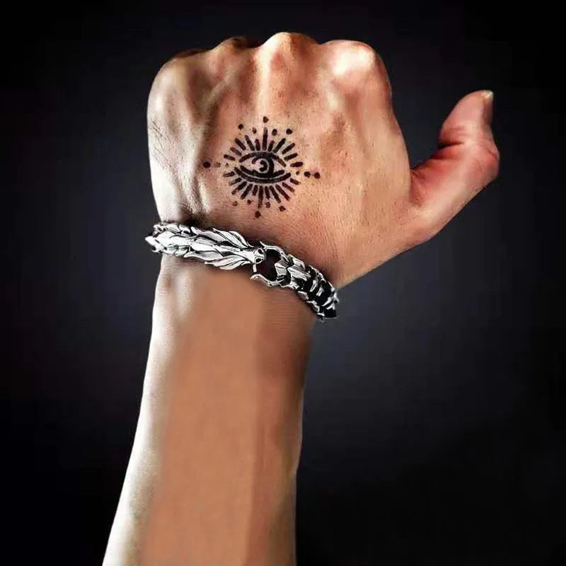 Men's silver geometric keel shape alloy bracelet on a neutral background showing minimal design
