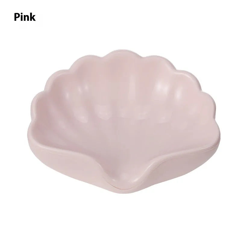 Plastic shell-shaped soap dish in pearl white colour for bathroom use