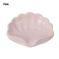Plastic shell-shaped soap dish in pearl white colour for bathroom use