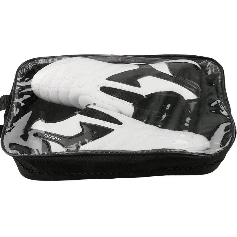 Black and white children's martial arts training shoes with a soft bottom and widened fit for Sanda and Taekwondo.