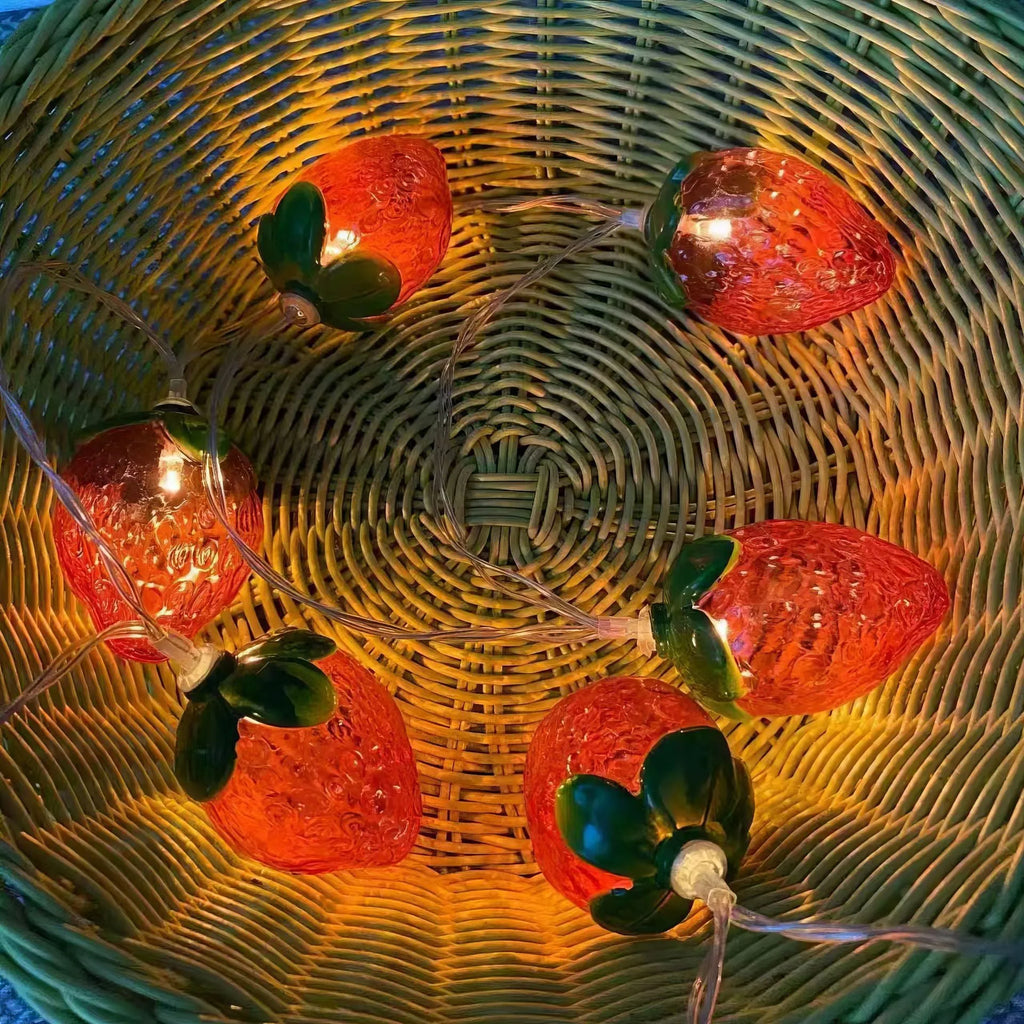 Warm strawberry-shaped LED string lights with IP66 protection, available in lengths from 1.5 m to 22 m.