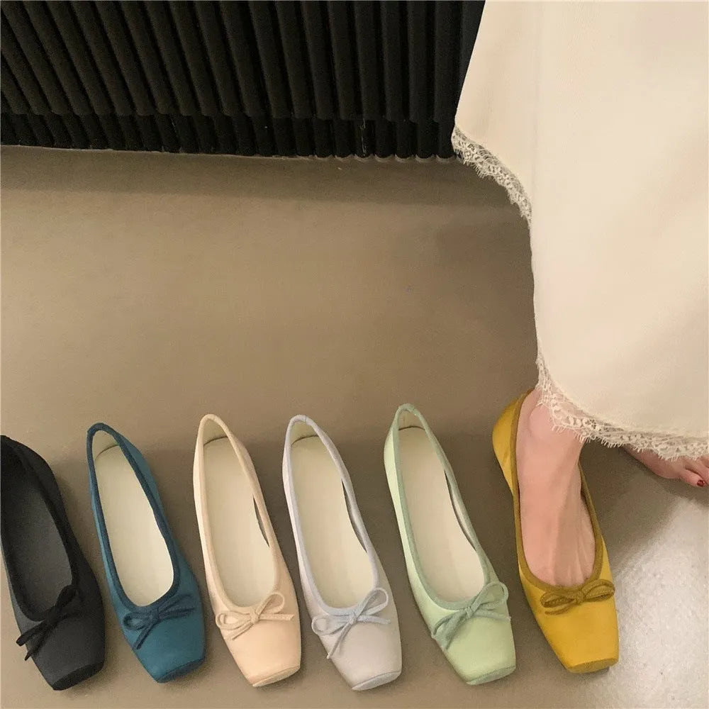 Women's satin shoes with hidden heels, square head and bow detail, available in six solid colours, sizes 35-40.